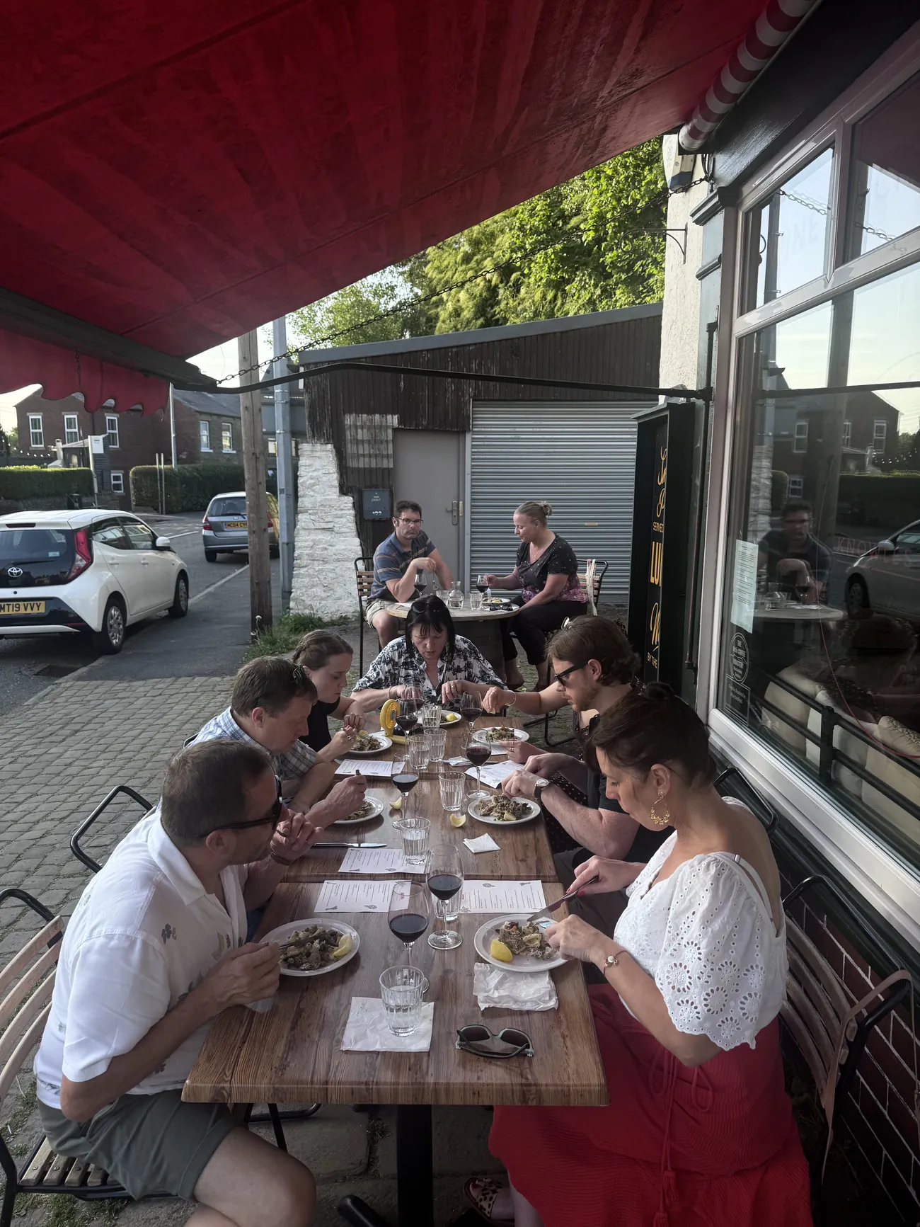 Guests enjoying the At Your Table tasting menu outside Knowles Green