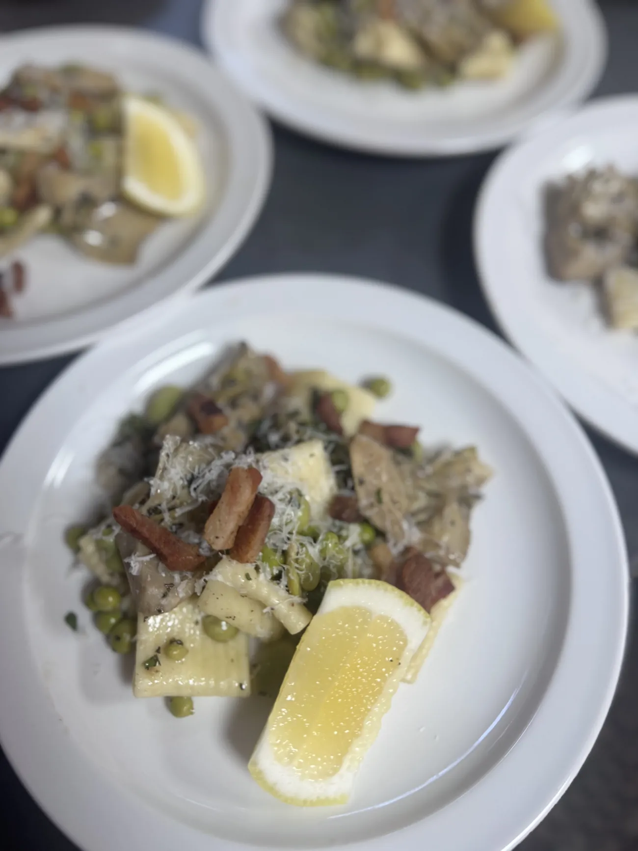 Vignarola pasta with crispy guanciale, peas and Pecorino