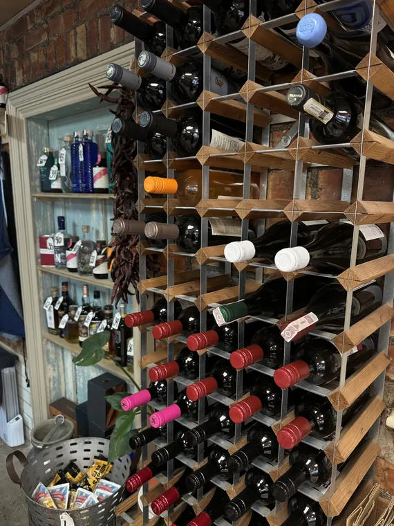 Wine and gin bottles on shelves